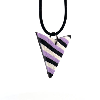 Black tube necklace with striped pendant